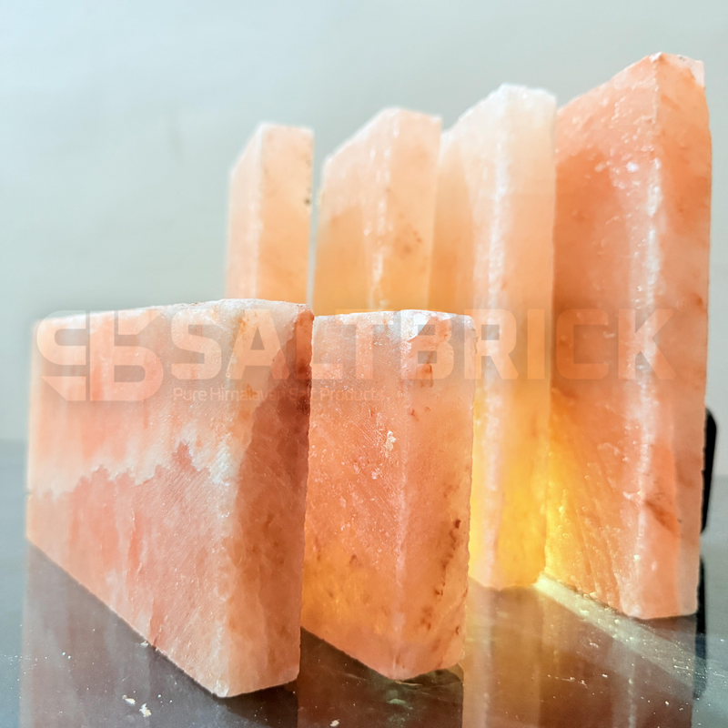 Himalayan salt lamp with a soft glow on a reflective surface